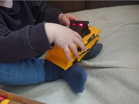 2-yo BeardGrabber playing with his CAT-licensed bulldozer.