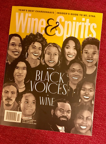 Wne & Spirits Magazine's cover, showing black people talking about wine 