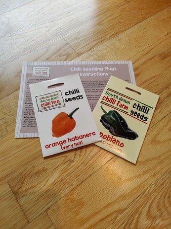 A packet of habanero and a packet of poblano seeds