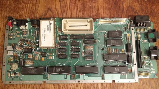 The Atari 600XL board with all the chips visible. They are all socketed.  That's good news as it requires less soldering.