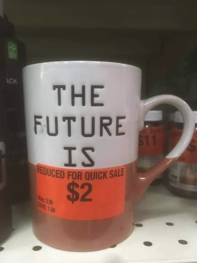 Mug. Text on mug: “The future is”. Sticker on mug: “reduced for quick sale $2”