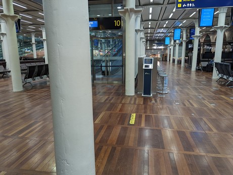 Eurostar departures. A wooden floor with glass dividers
