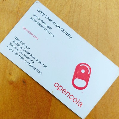 A relic. My business card from OpenCOLA - yes, the logo is the pull tab from a can of the cola we gave away as expo swag, the recipe printed on the label. 