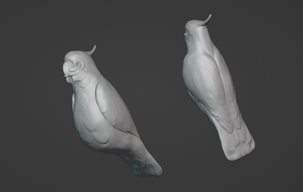 Two matcap views of the cockatoo sculpt. Some feather detailing can be seen, and it's obvious that there are no feet