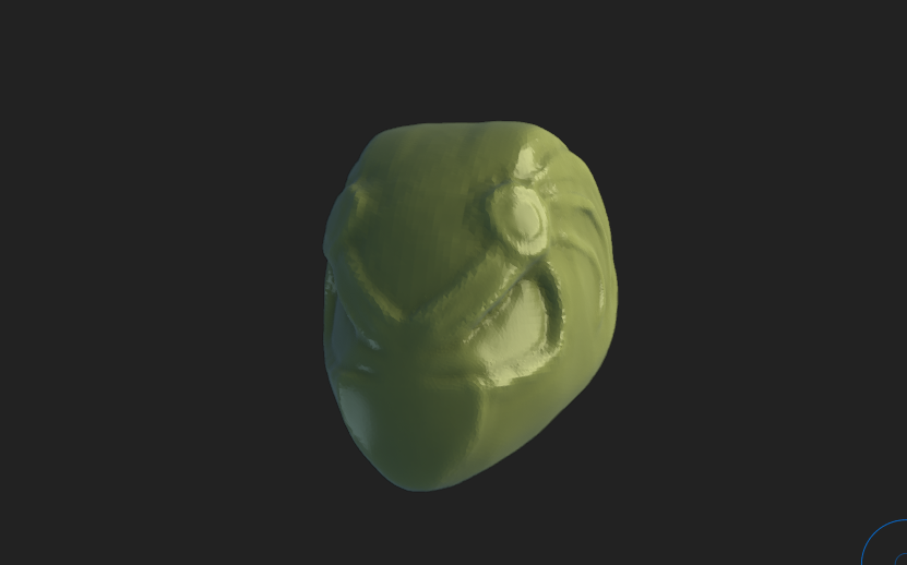 A rough sculpt of an angry looking alien head