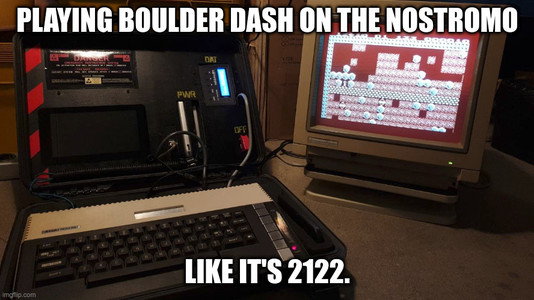 A portable Atari 800XL and an external 1084 CRT monitor showing a "Boulder Dash" game screen.

Meme-text: Playing Boulder Dash on the Nostromo like it's 2122.
