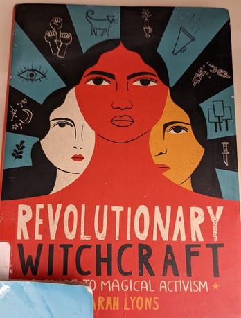 A photo of the cover of "Revolutionary Witchcraft" by Sarah Lyons.

Another book obscures the bottom left corner where the library barcode is.