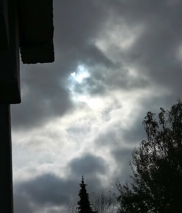 Partial solar eclipse seen through some - not too thick - clouds. 