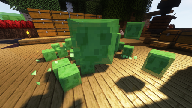 An invasion of green slime cubes in the centre of my base with lots of little slimes coming toward the camera and one jumping up dead centre in the frame.