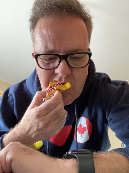Brittlestar scarfs down yet another Coffee Crisp while reading his watch