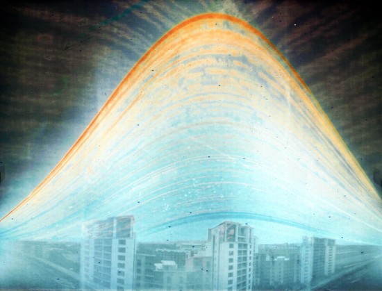 Sun arcs through the sky over six months. Taken from a high building. Tower blocks are visible