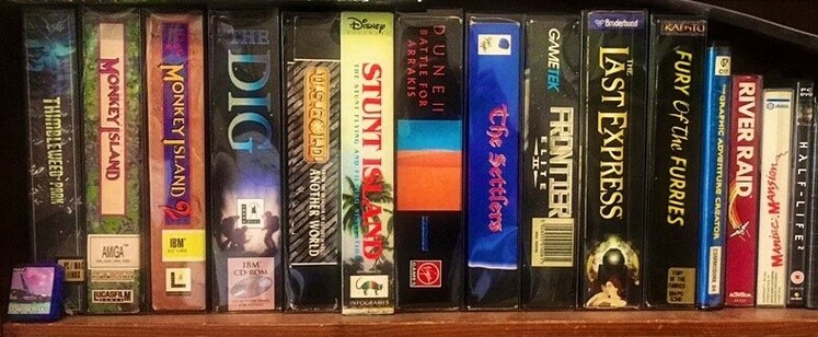 Shelf with about 15 classic (mostly) "big box" PC games, inc. Lucasfilm Games adventure classics, Another World, Dune 2, The Last Express and many more