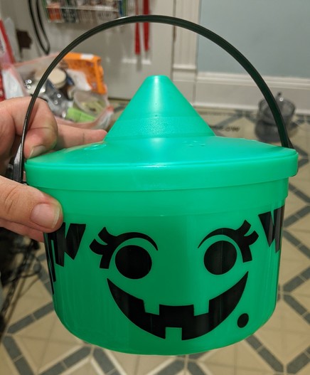 A photo of the original green witch pail from the McDonalds Happy Meals 