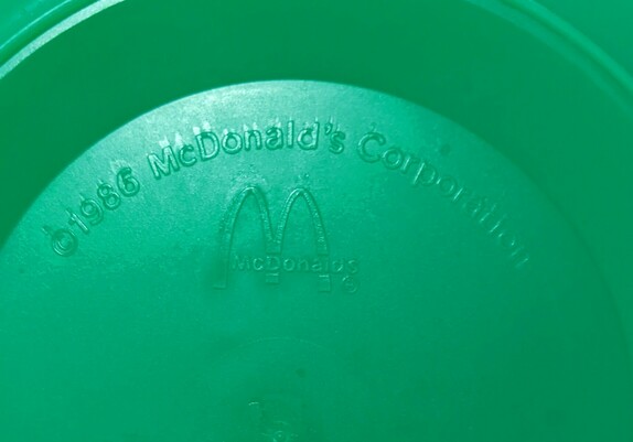The bottom of the original green witch pail from the McDonalds Happy Meals stamped with the date 1986