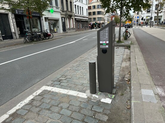Charging station that’s placed between two parking spots, not on the pavement.