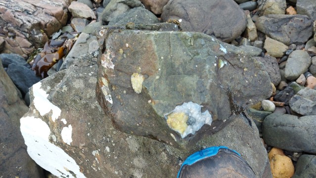 Small boulder with amygdales - boot for scale (UK size 12!)