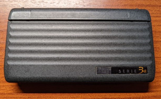 Psion 3a closed: a grey elegant device the size of a glasses case.