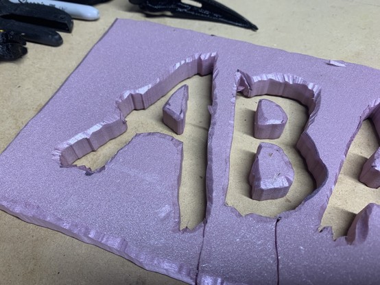 closeup of bevels on the letters A B on a foamboard sign