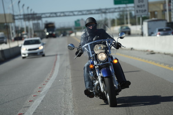 Biker on a harley, riding behind my vehicle on I4