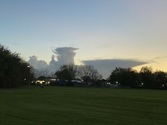 Battleship grey low lying cloud in the shape of an aircraft carrier