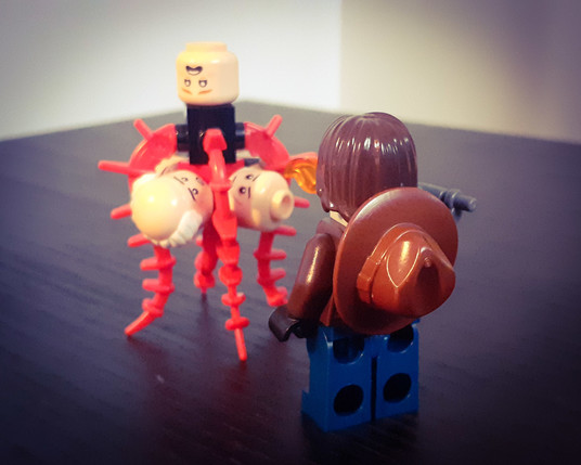 MacReady aiming his flamethrower at THE THING
