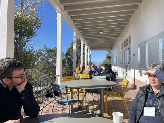 Attendees discussing scaling at the Santa Fe Institute 