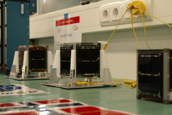 FUNcube standing in the clean room between HiNCube and ZAcube-1, ready for placement in the ISIPOD