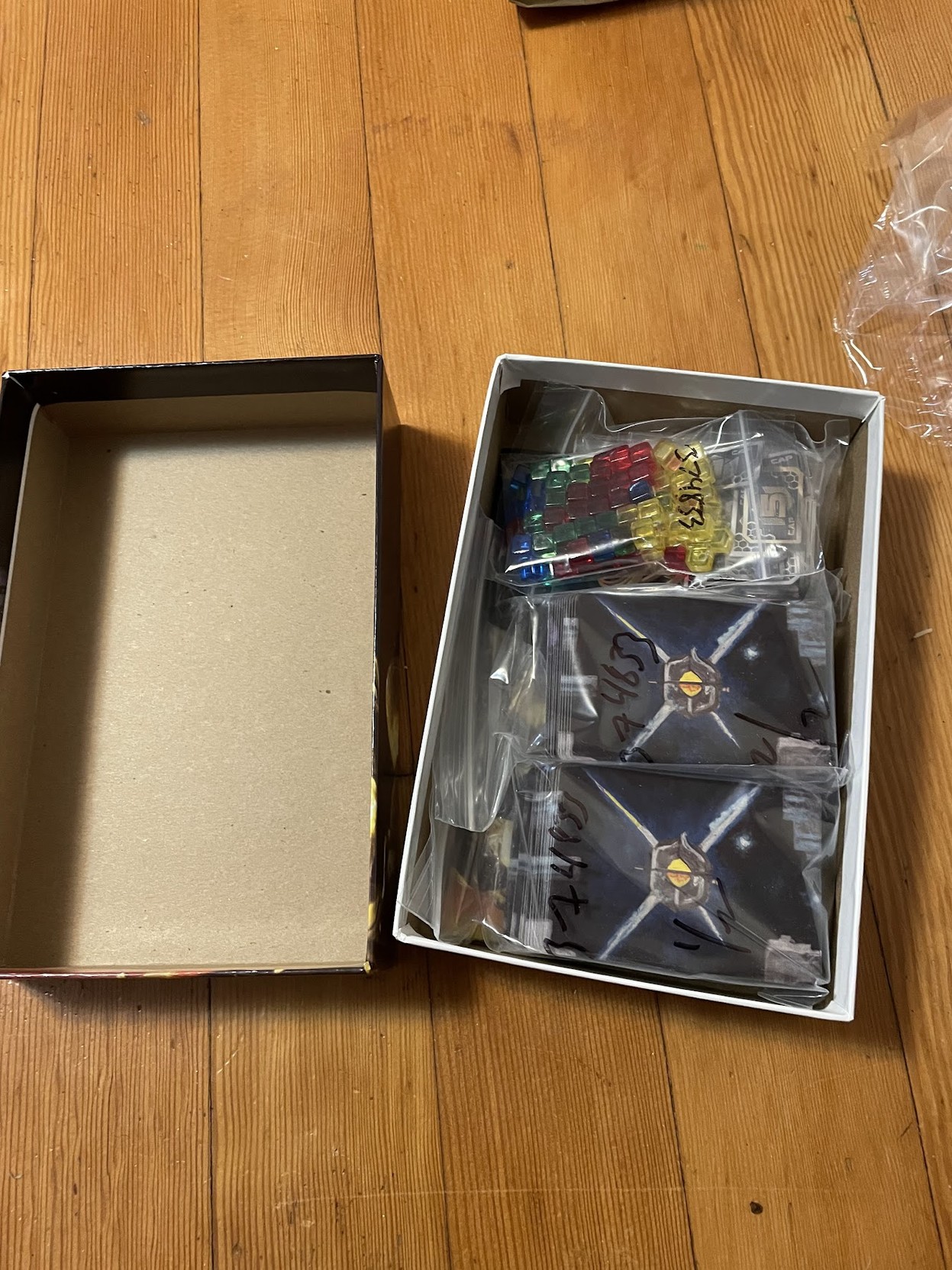 The contents of the box as it was opened, still in their packaging from the printer.