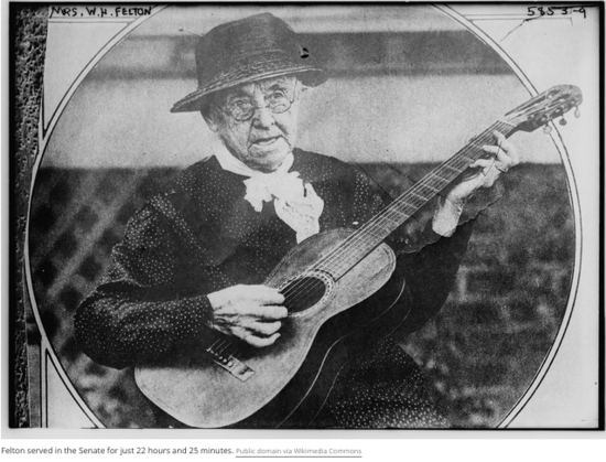 Rebecca Latimer Felton plays guitar. Felton was the first female member of the US Senate. Photo public domain via Wikimedia Commons.
