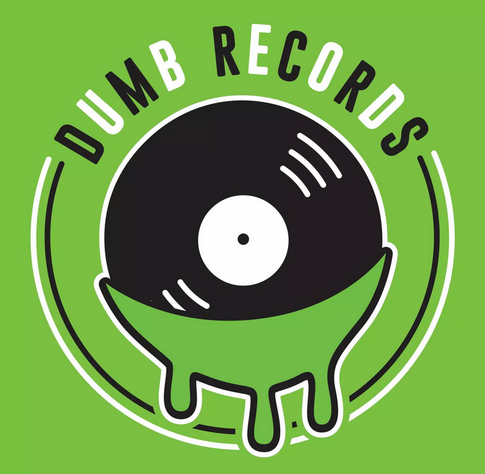 A black vinyl album dripping in green beneath the text DUMB RECORDS in alternating black and white text.