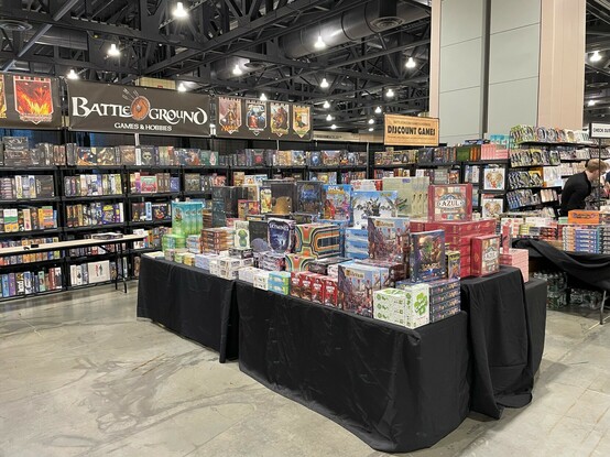 The Battleground booth is filled with board games. 