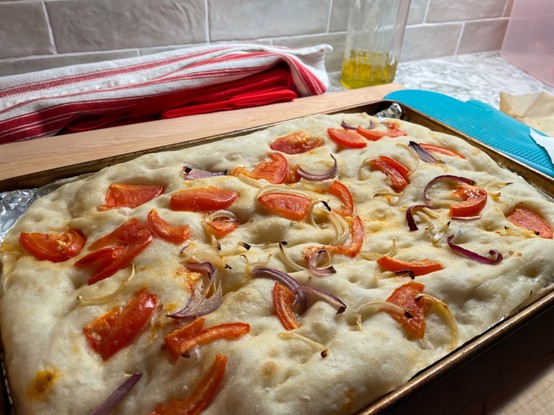 Breakfast Focaccia with tomatoes and onions no cheese fresh from home oven