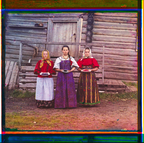 ergei Prokudin-Gorsky, Peasant Girls [Russian Empire], 1909, digital colour composite by Blaise Agüera y Arcas, 2004. Three young women offer berries to visitors of their izba, a traditional wooden house, in a rural area along the Sheksna River, near the town of Kirillov. 