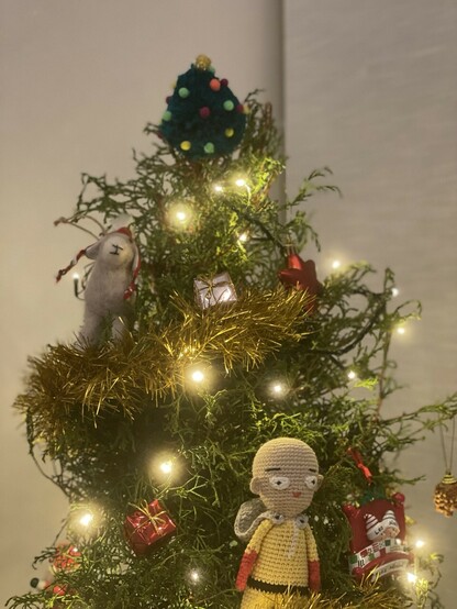 A Christmas tree with a small tree at the top
