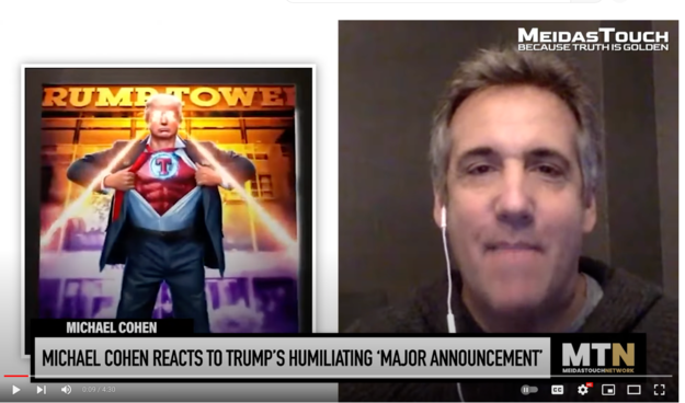 Screenshot - new Meidas Touch video, with Michael Cohen reacting to  the new 'big announcement' of a Christmas grift like nobody's seen before: NFT-based superhero "cards". With MTG space lasers and  serious cosplay superhero attire.
