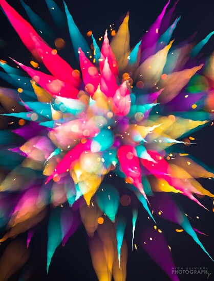A colorful field of out-of-focus fireworks create an abstract piece of art