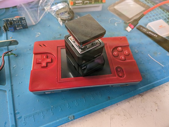 Mini wave MH030 sat on top of a gameboy macro to show the size