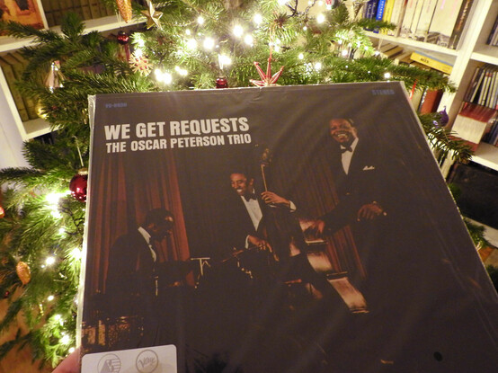 Oscar Peterson Trio album: We Get Requests in front of a Christmas tree.