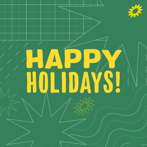 On a green background with stars, the text 'Happy holidays!'