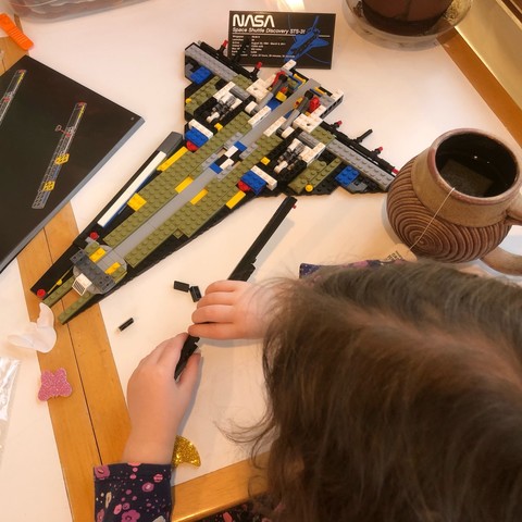 4yo little fingers snapping LEGO parts together. 