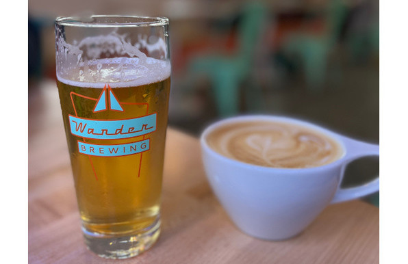 A pint of beer sits next to a latte at Wander Brewing's new coffee shop and taproom in Bellingham.