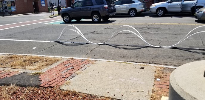 Close up of wave design bike lane barrier
