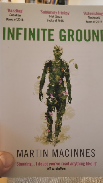 Cover of Infinite Ground by Martin Macinnes. A human figure composed of plant matter.