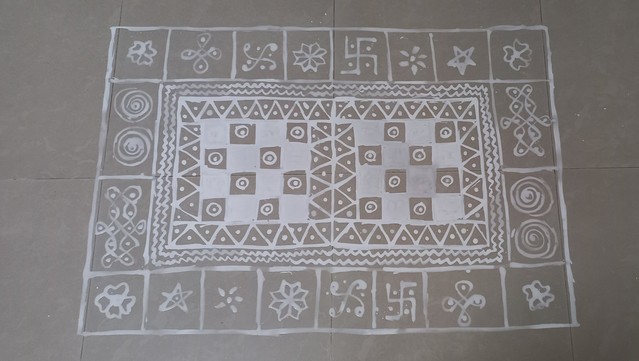 Kolam (Tamil traditional drawing) drawn with rice flour