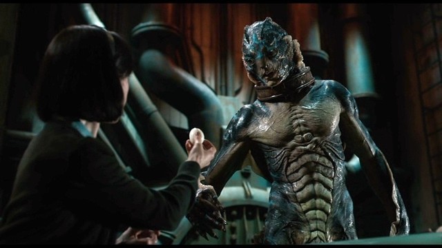 Sally Hawkins offering an egg to the creature from The Shape of Water.