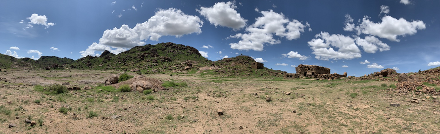 The site stretches across the entire valley, bounded by the mountains. 