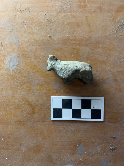 A small figurine of an animal. 