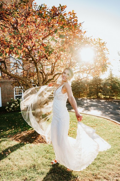 Bride at golden hour twirling in her wedding dress. 