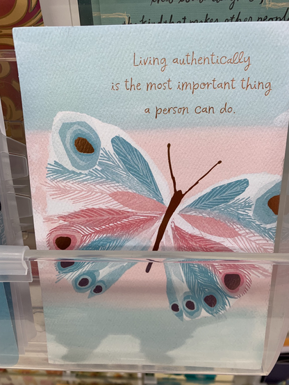 Blue, pink and white greeting card with a butterfly on the front that says “Living authentically is the most important thing a person can do”