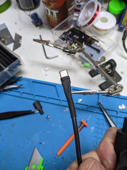 Heat shrink tubing covering the new soldered usb c port
